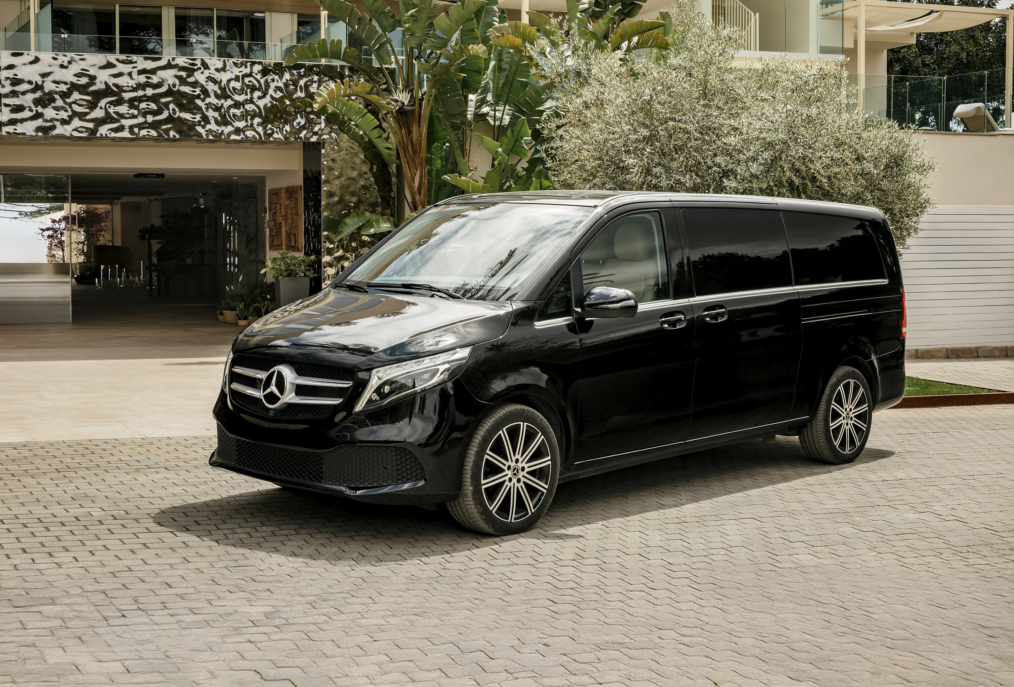 a black van parked in front of a building