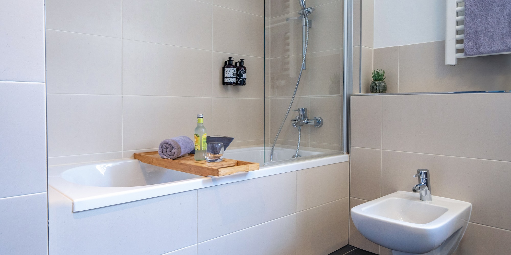 a bathroom with a bathtub and sink