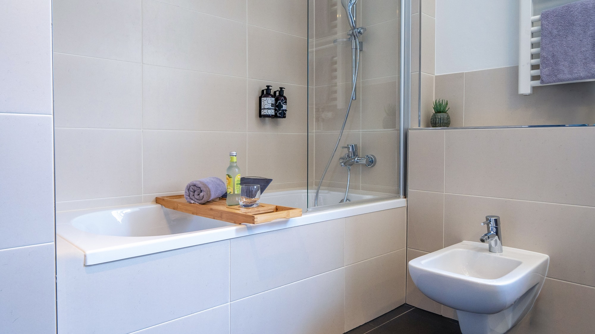 a bathroom with a bathtub and sink