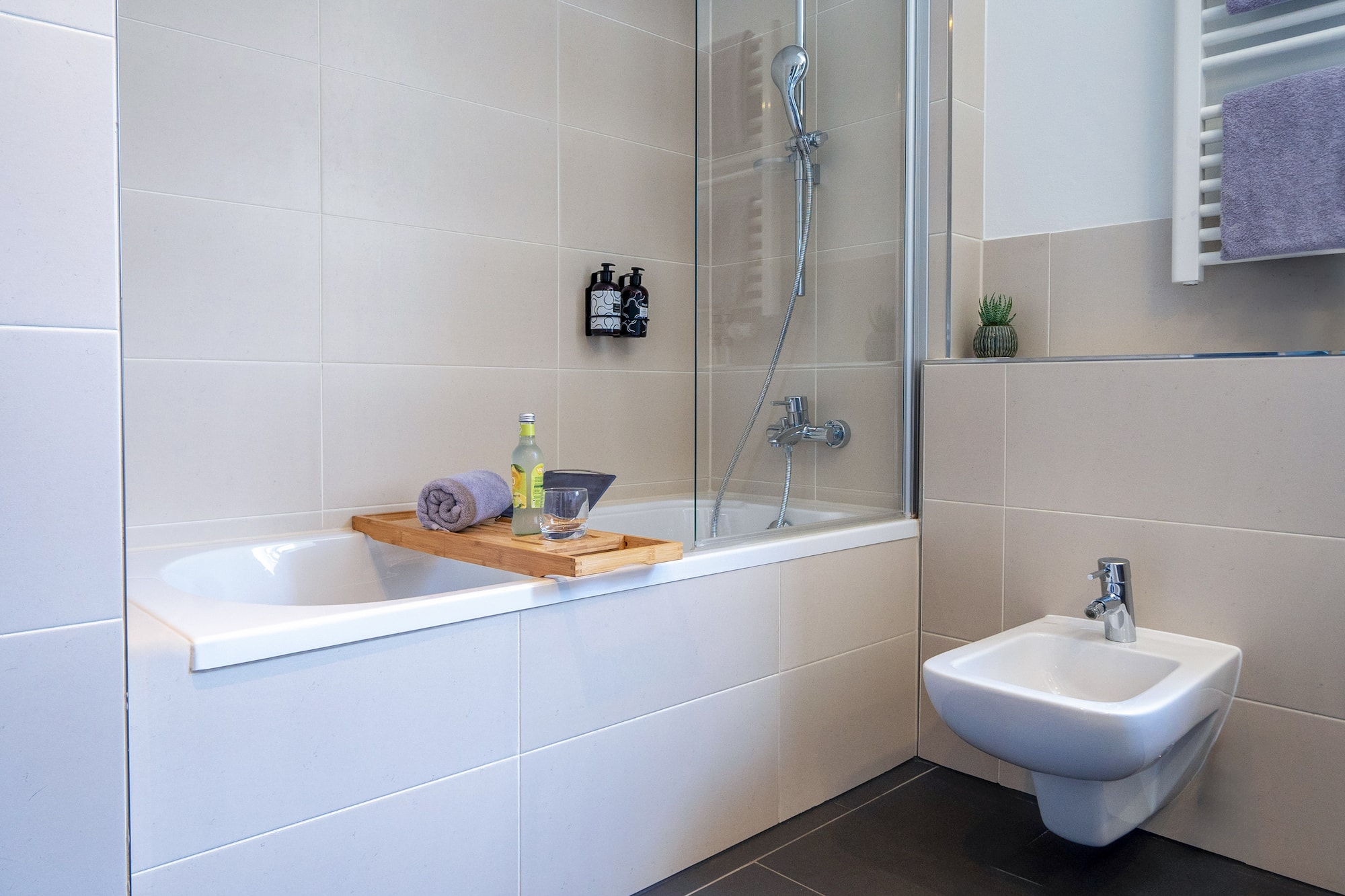 a bathroom with a bathtub and sink