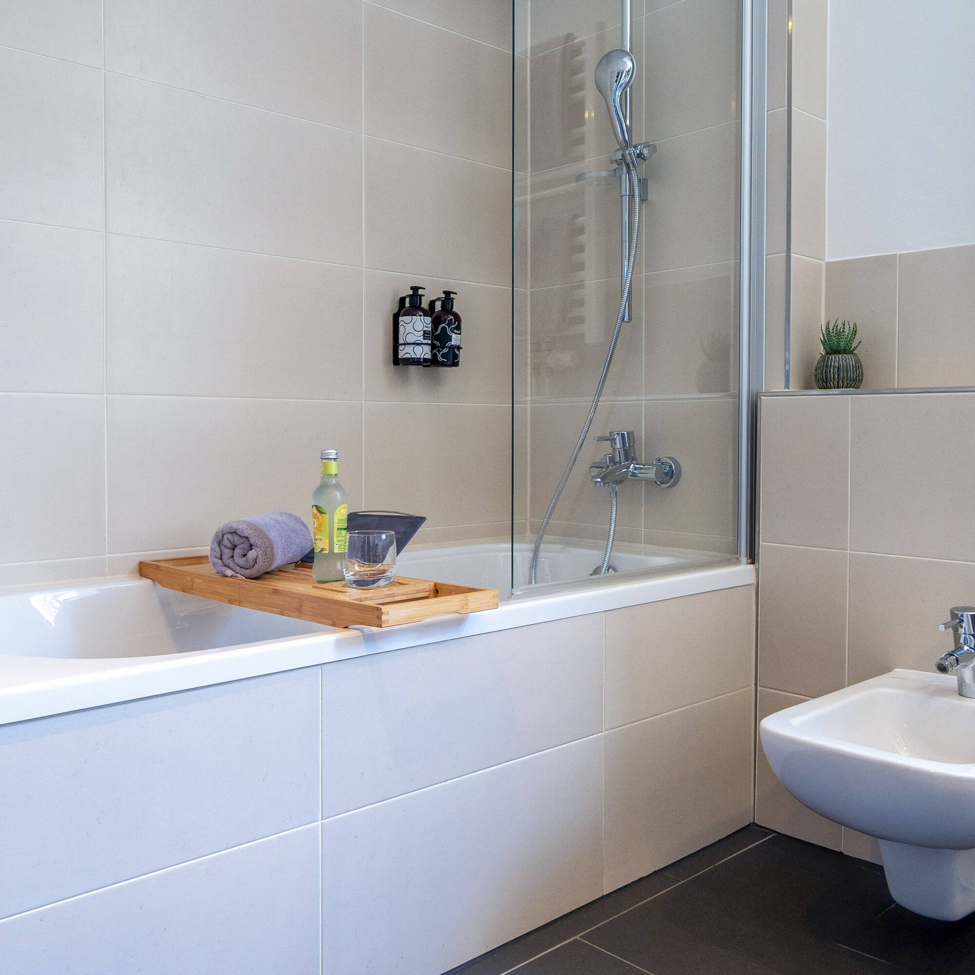 a bathroom with a bathtub and sink