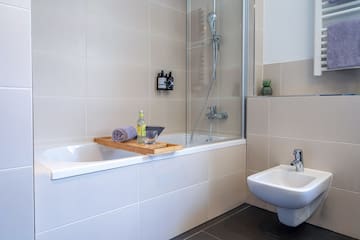 a bathroom with a bathtub and sink