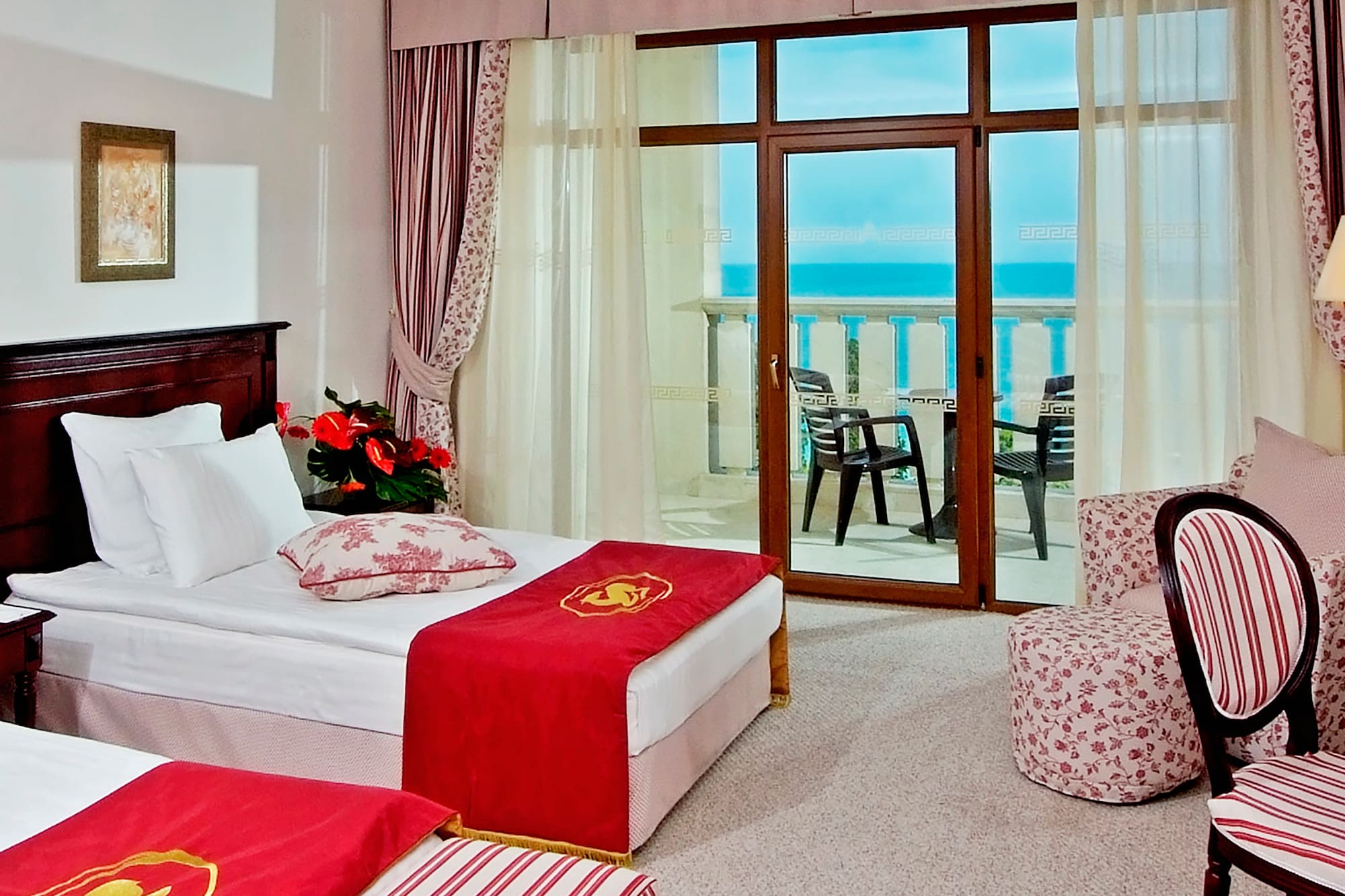 a room with two beds and a window