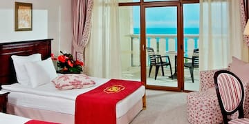 a room with two beds and a window