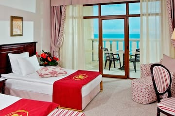 a room with two beds and a window