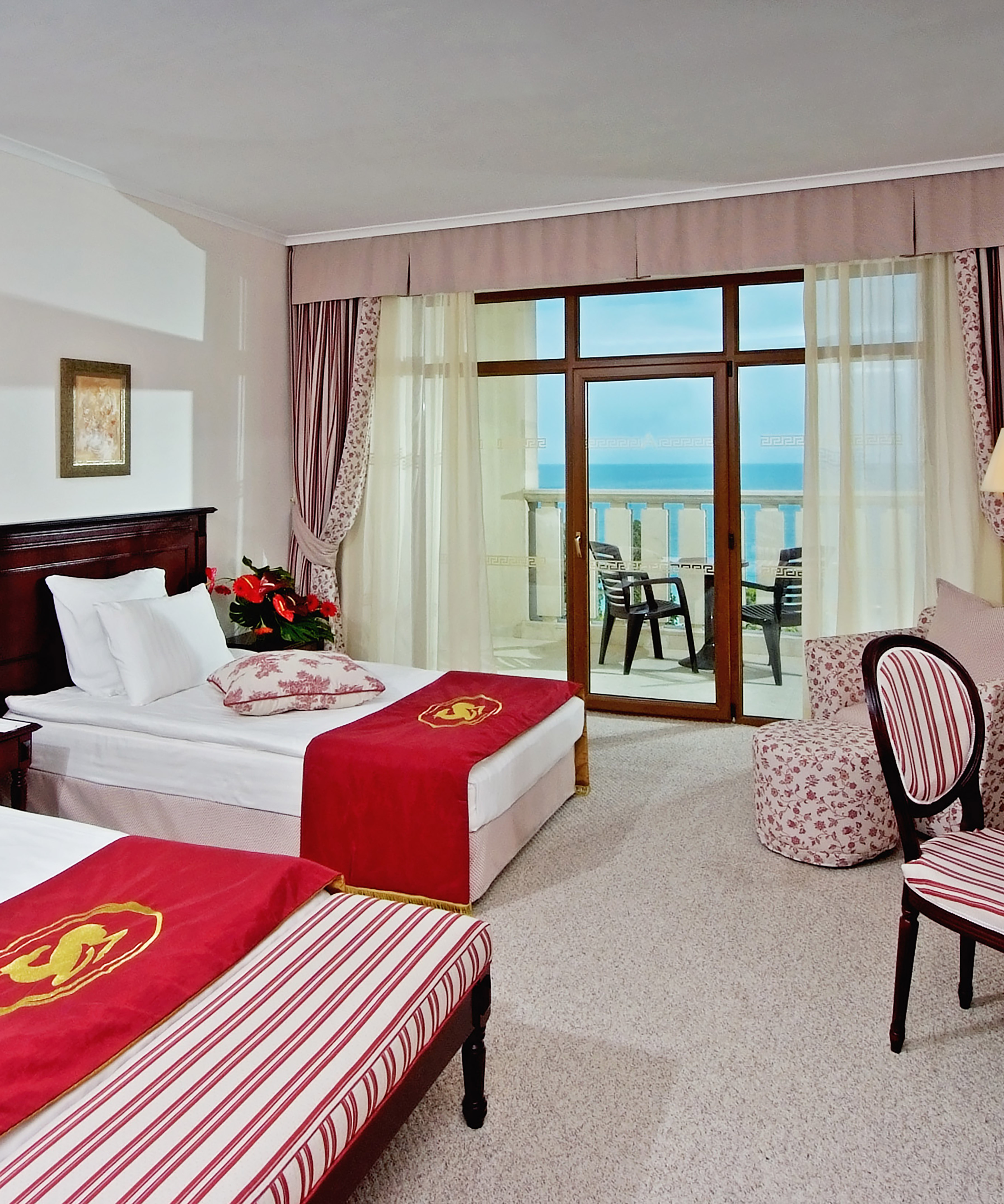 a room with two beds and a window