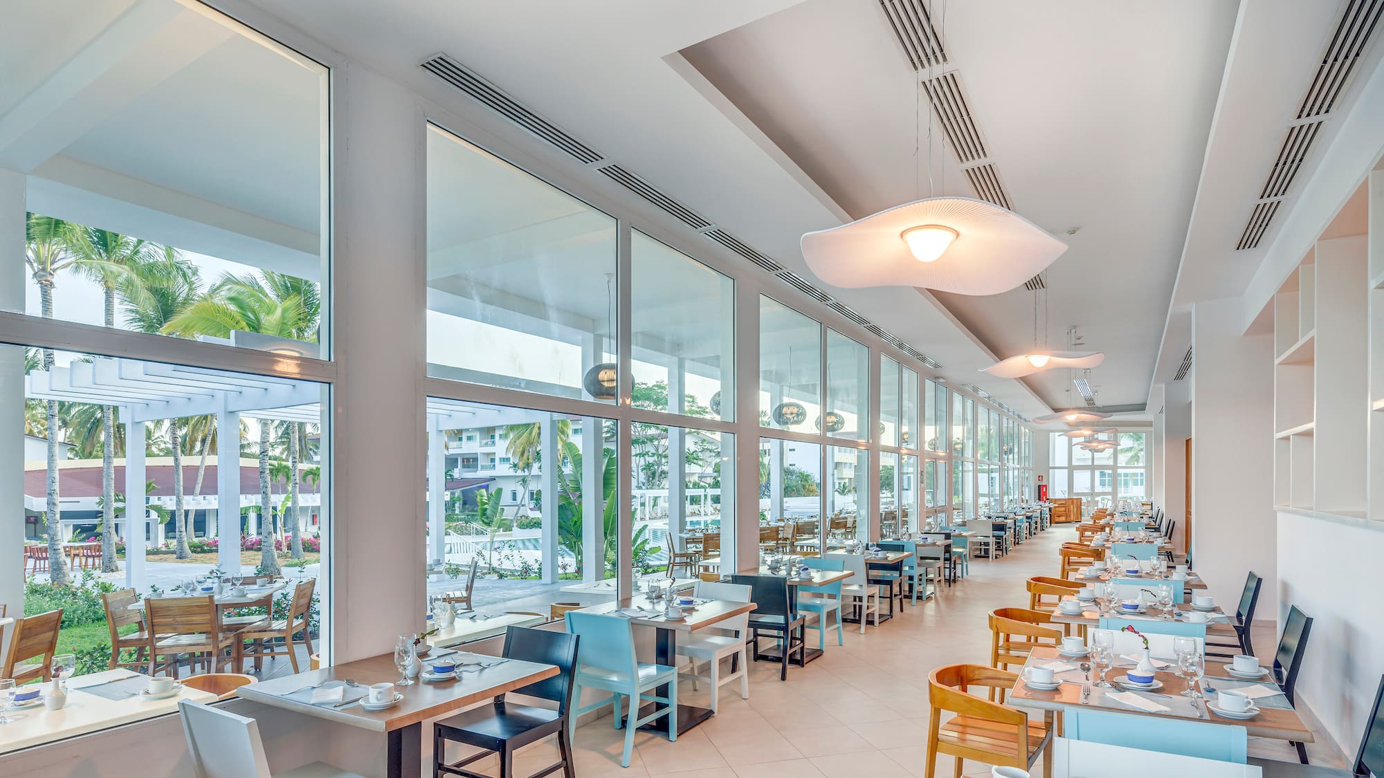 a restaurant with tables and chairs