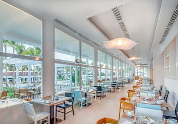 a restaurant with tables and chairs