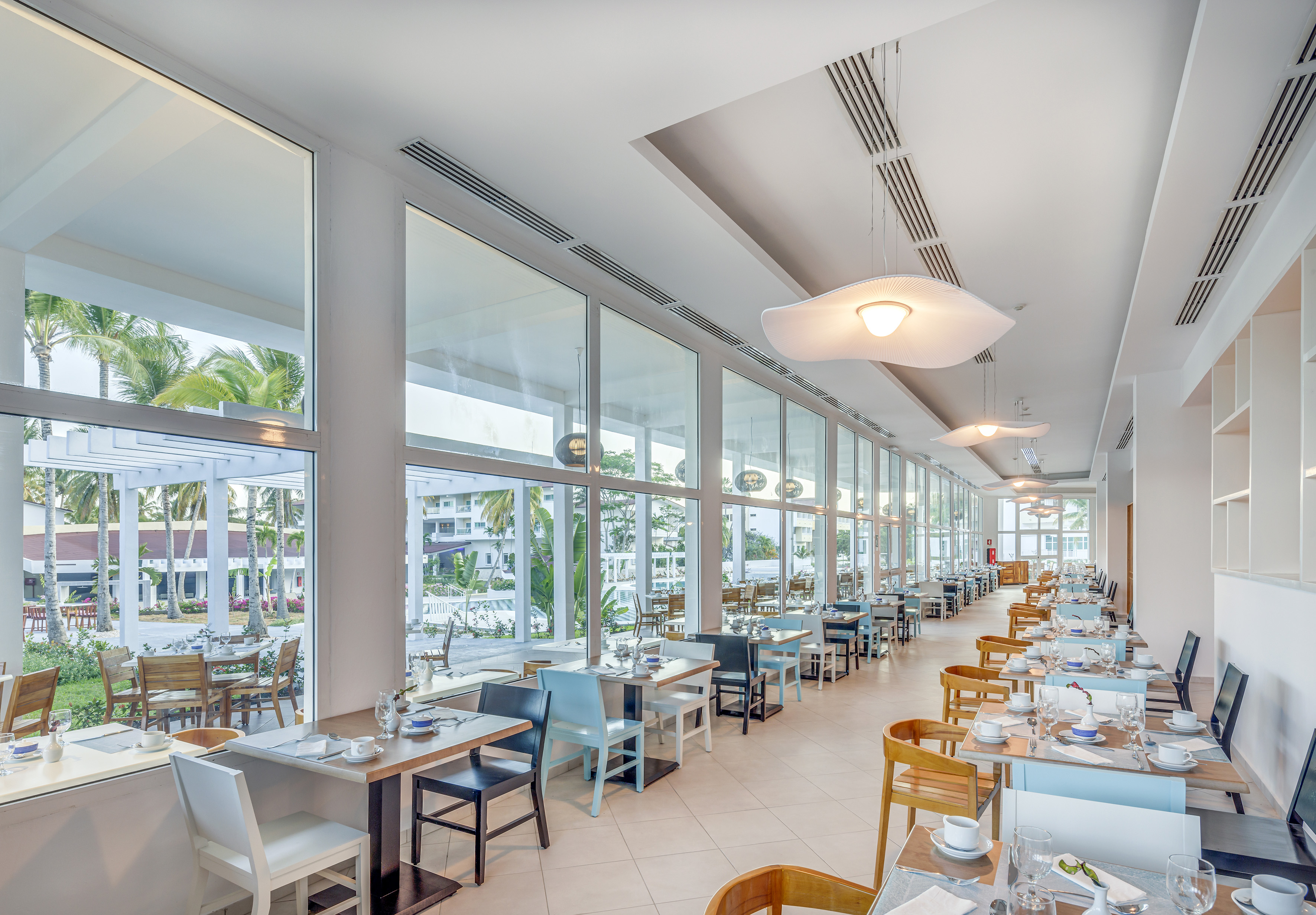 a restaurant with tables and chairs