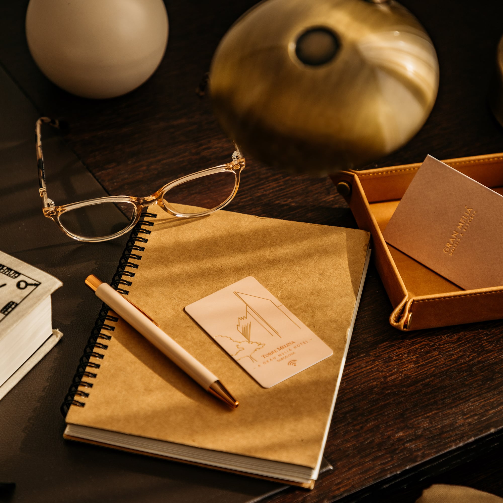 a notebook and pen on a table