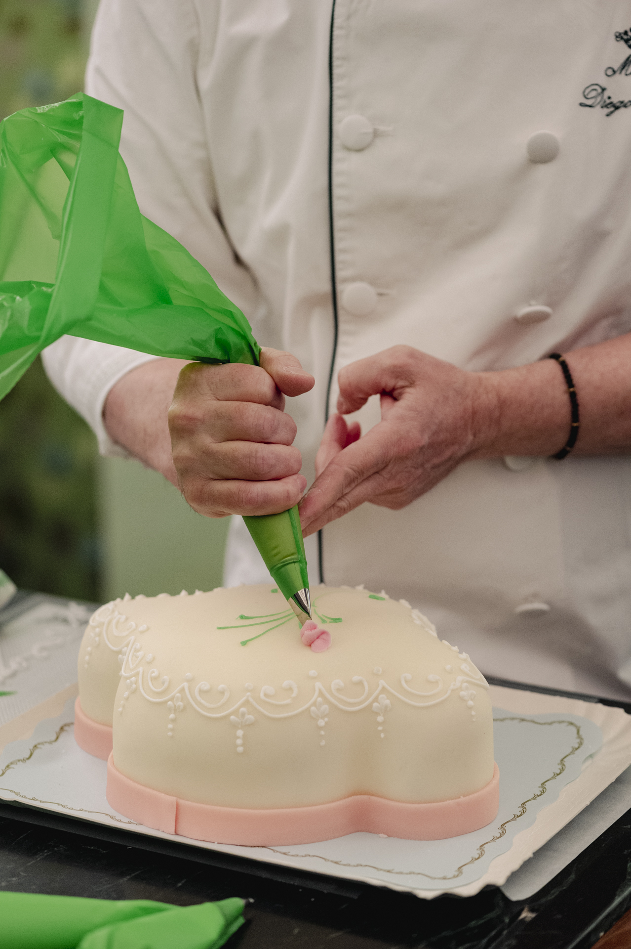 a person decorating a cake