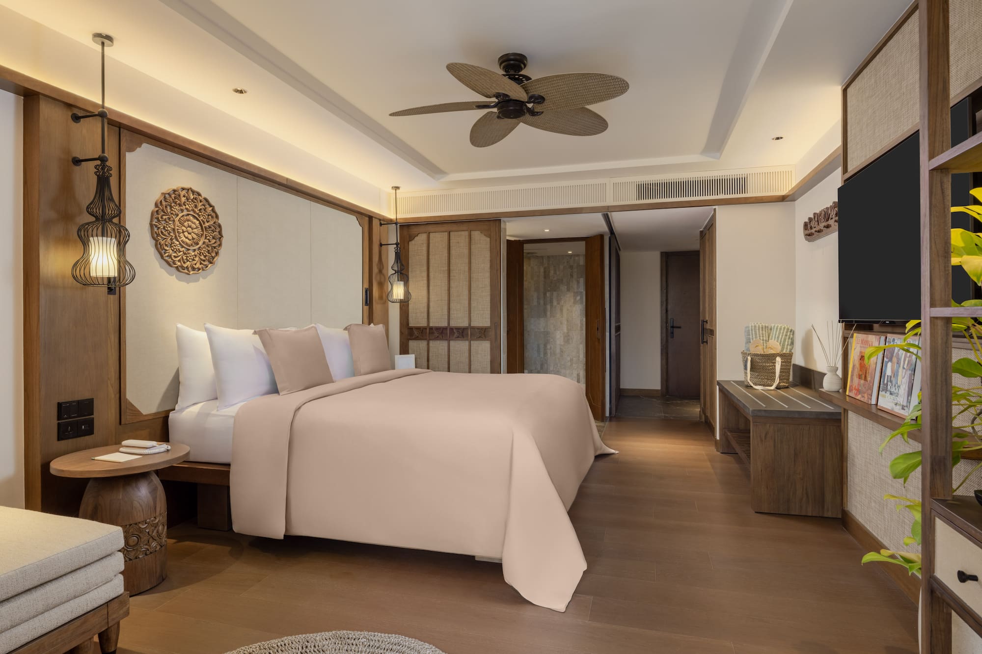 a bedroom with a television and a bed