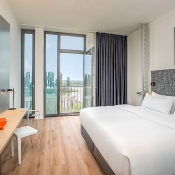 a room with a bed and a desk