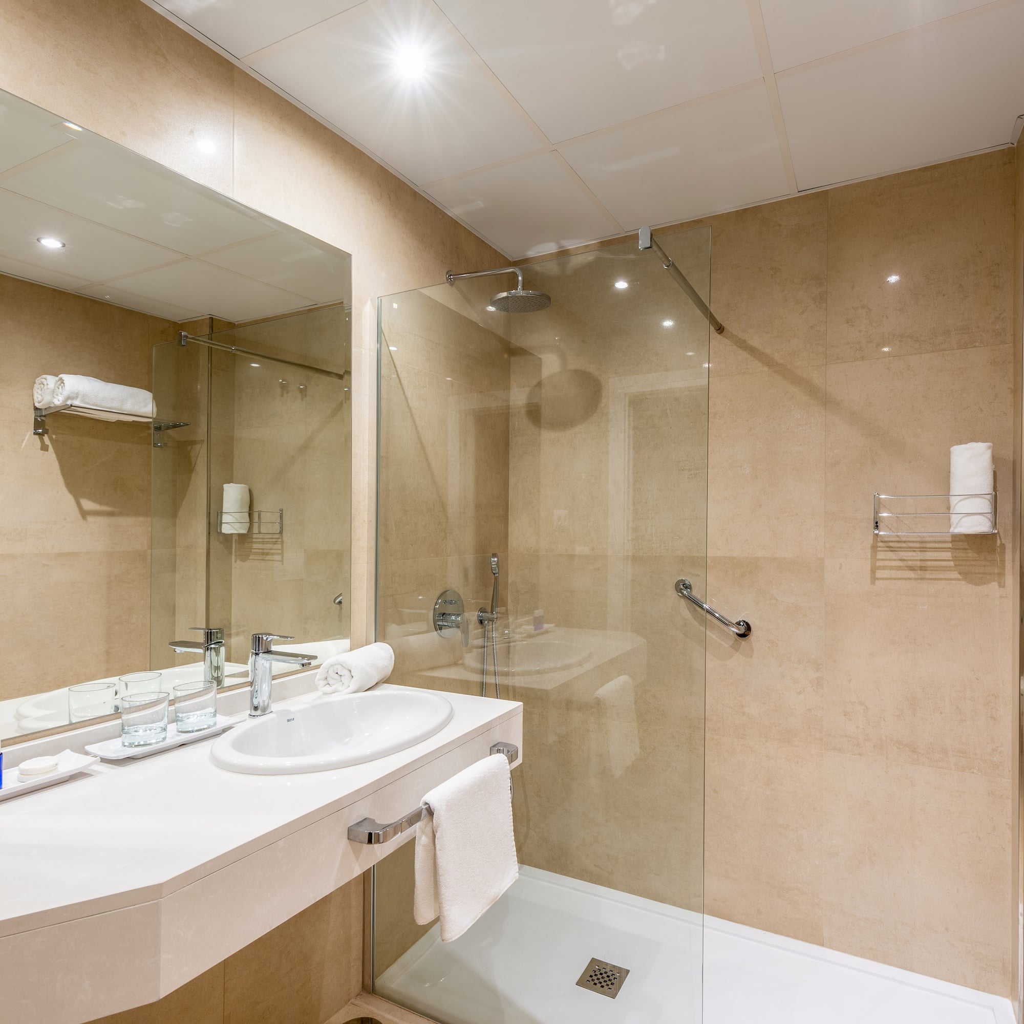 a bathroom with a shower and sink