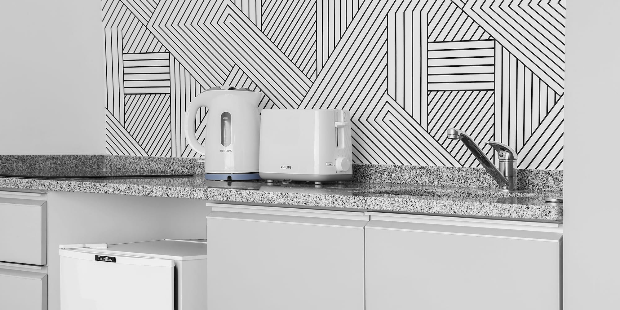 a white toaster and a toaster on a counter
