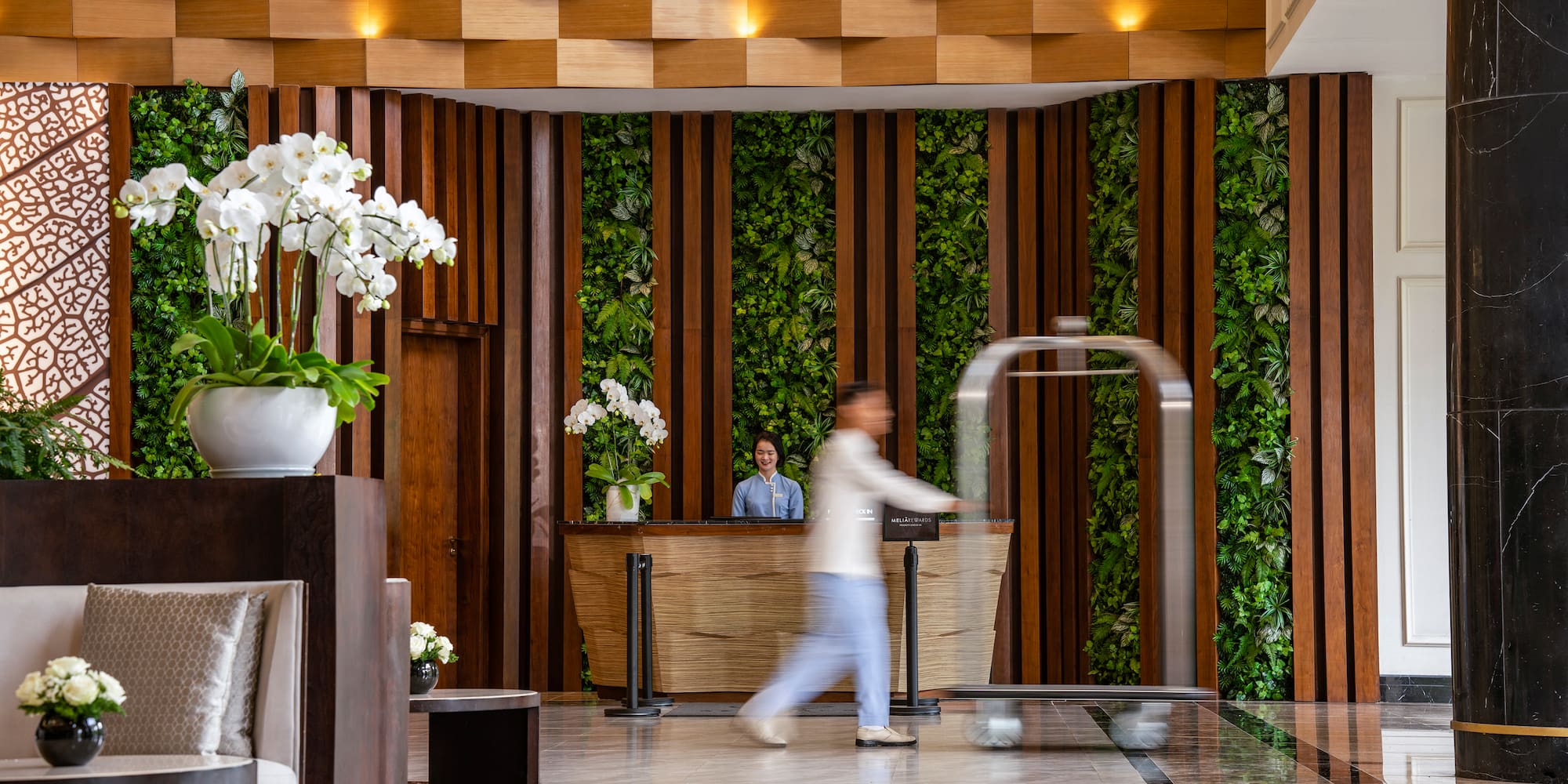 a man walking in a lobby