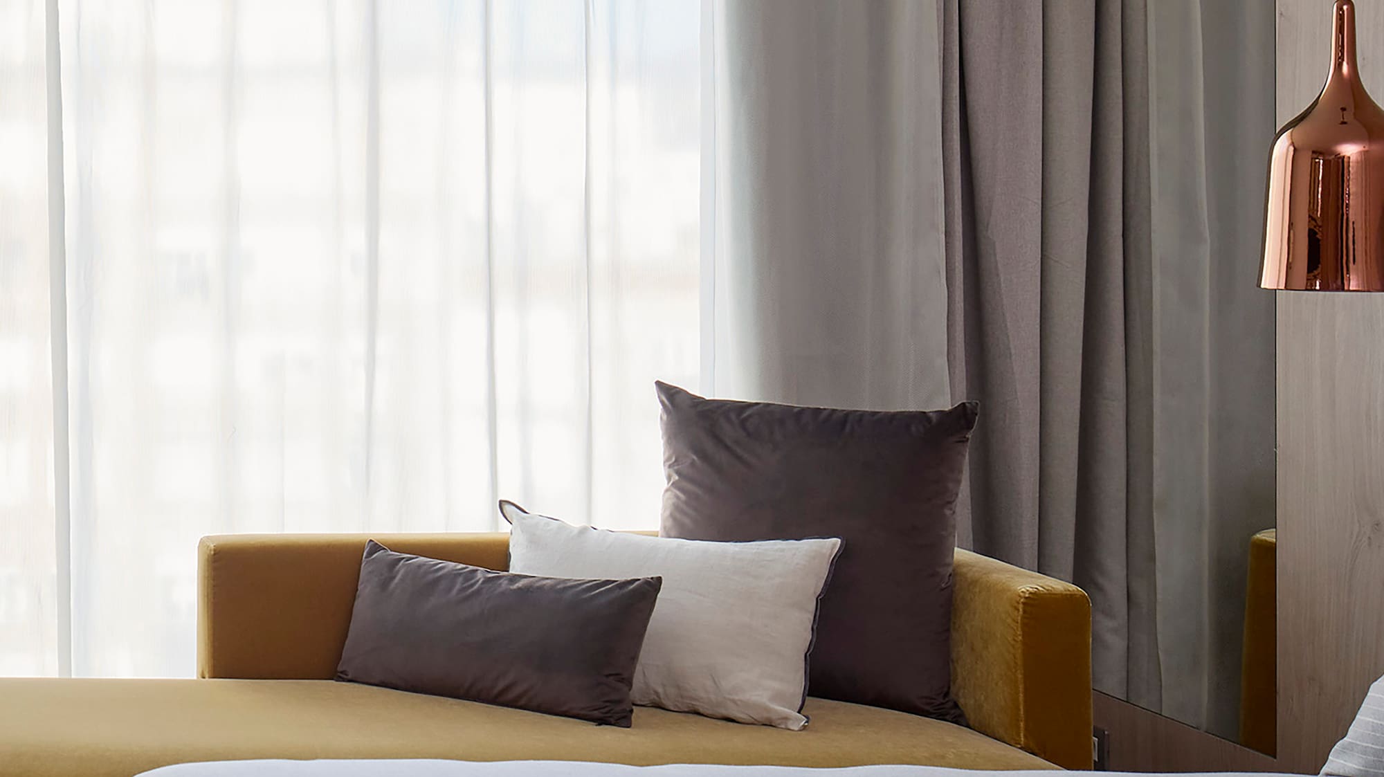 a bed and couch in a room