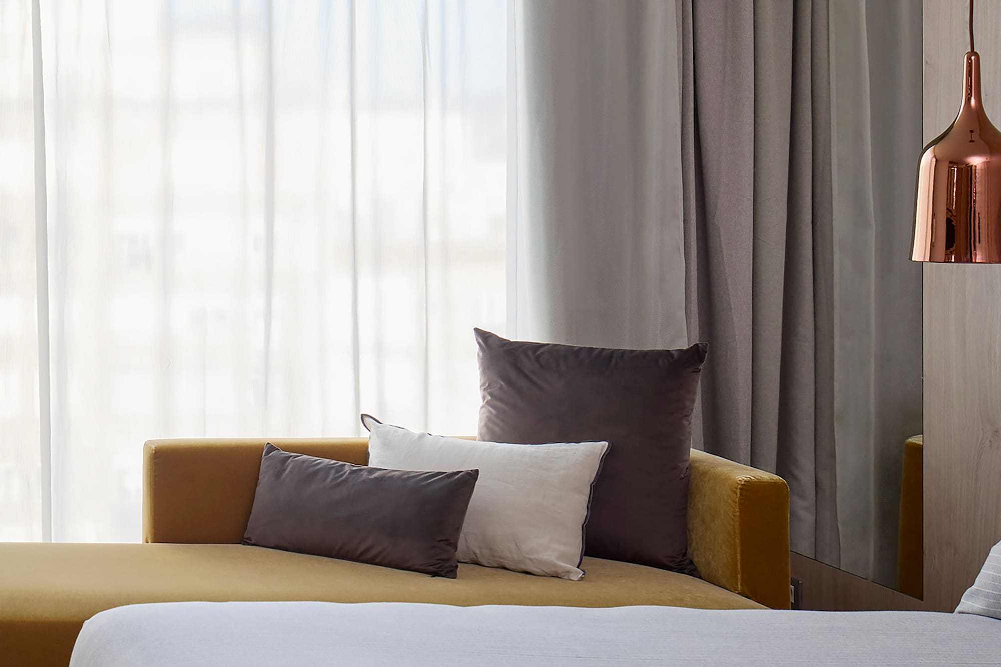 a bed and couch in a room