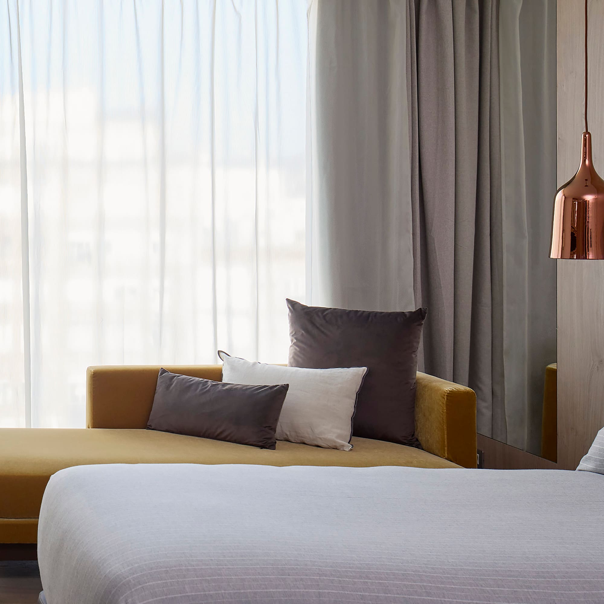 a bed and couch in a room