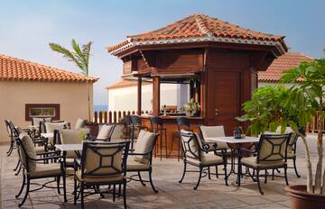 a patio with chairs and tables