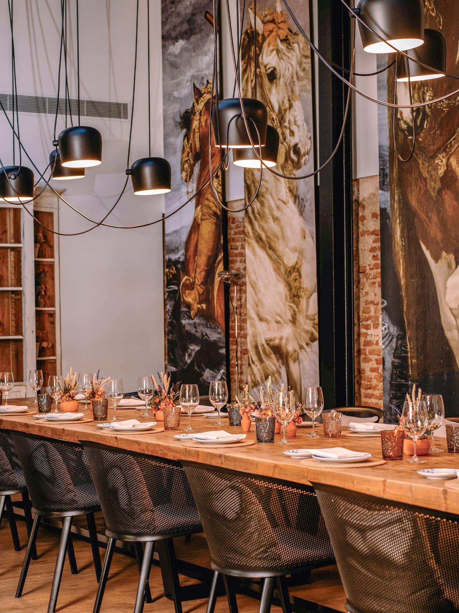 a long table with plates and glasses