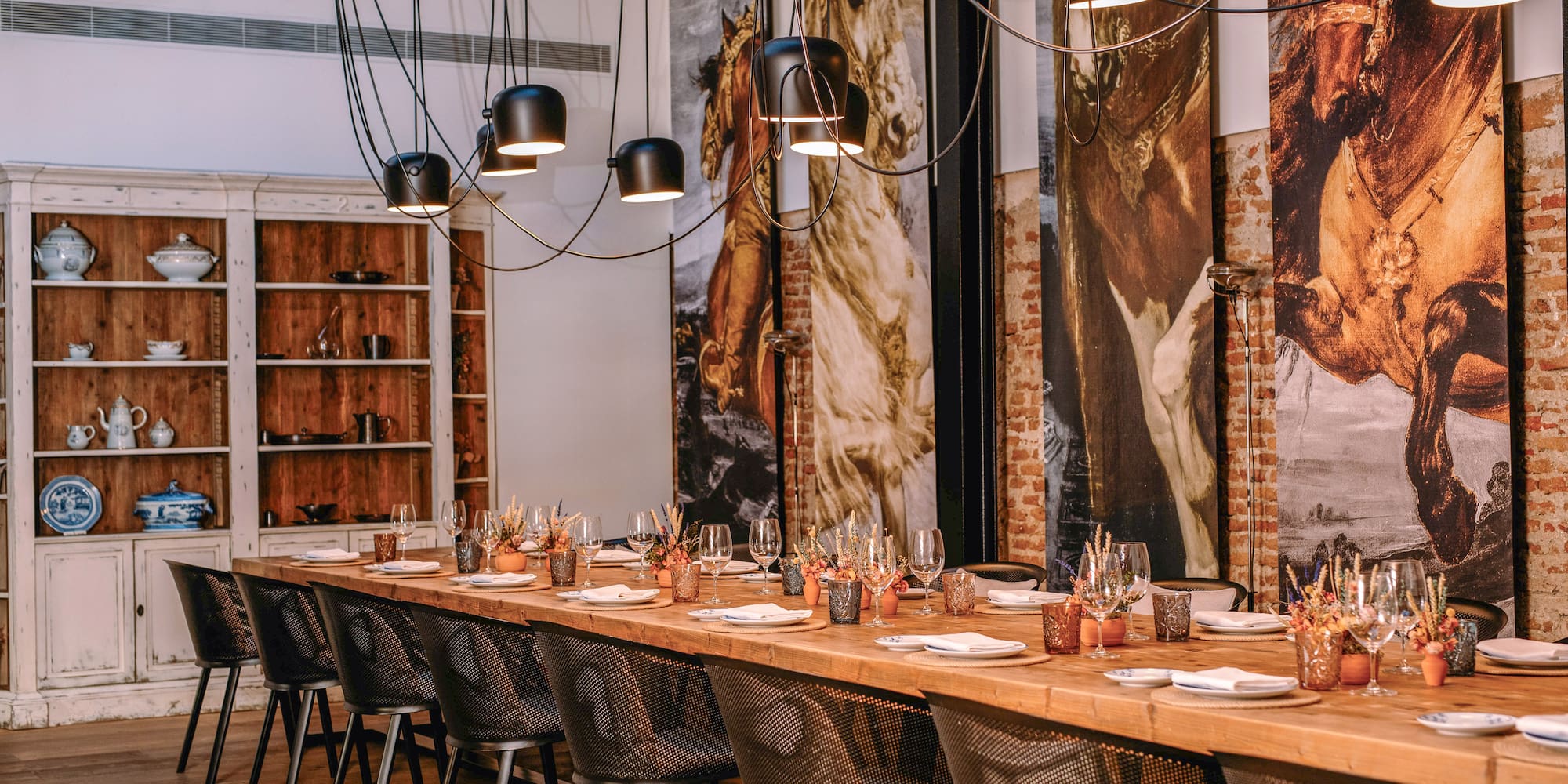 a long table with plates and glasses