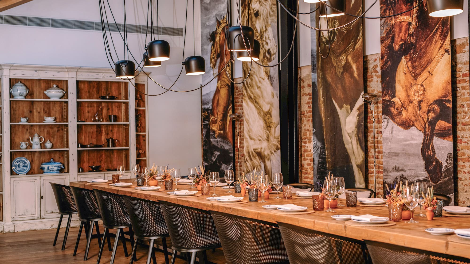 a long table with plates and glasses