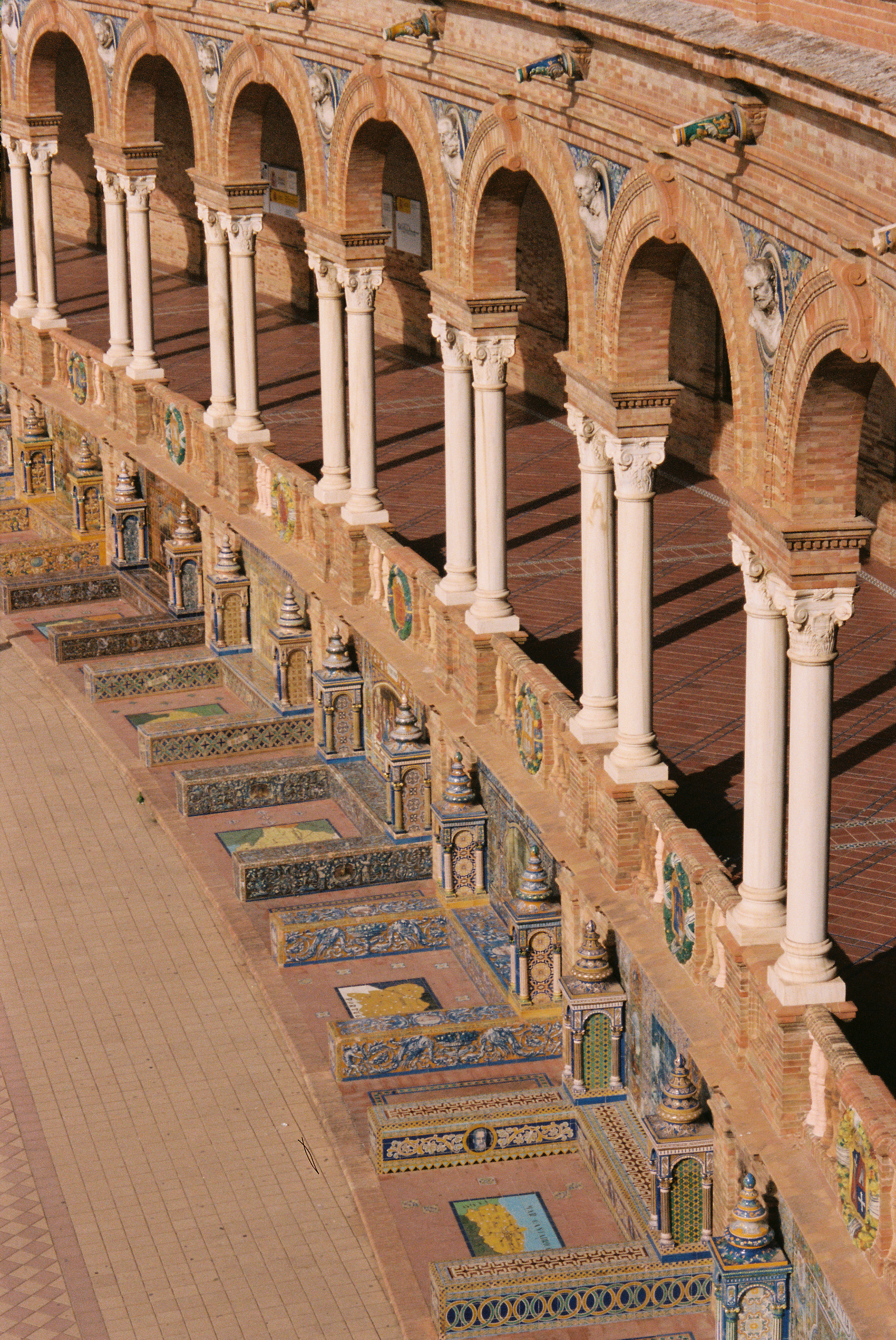 a brick building with white pillars