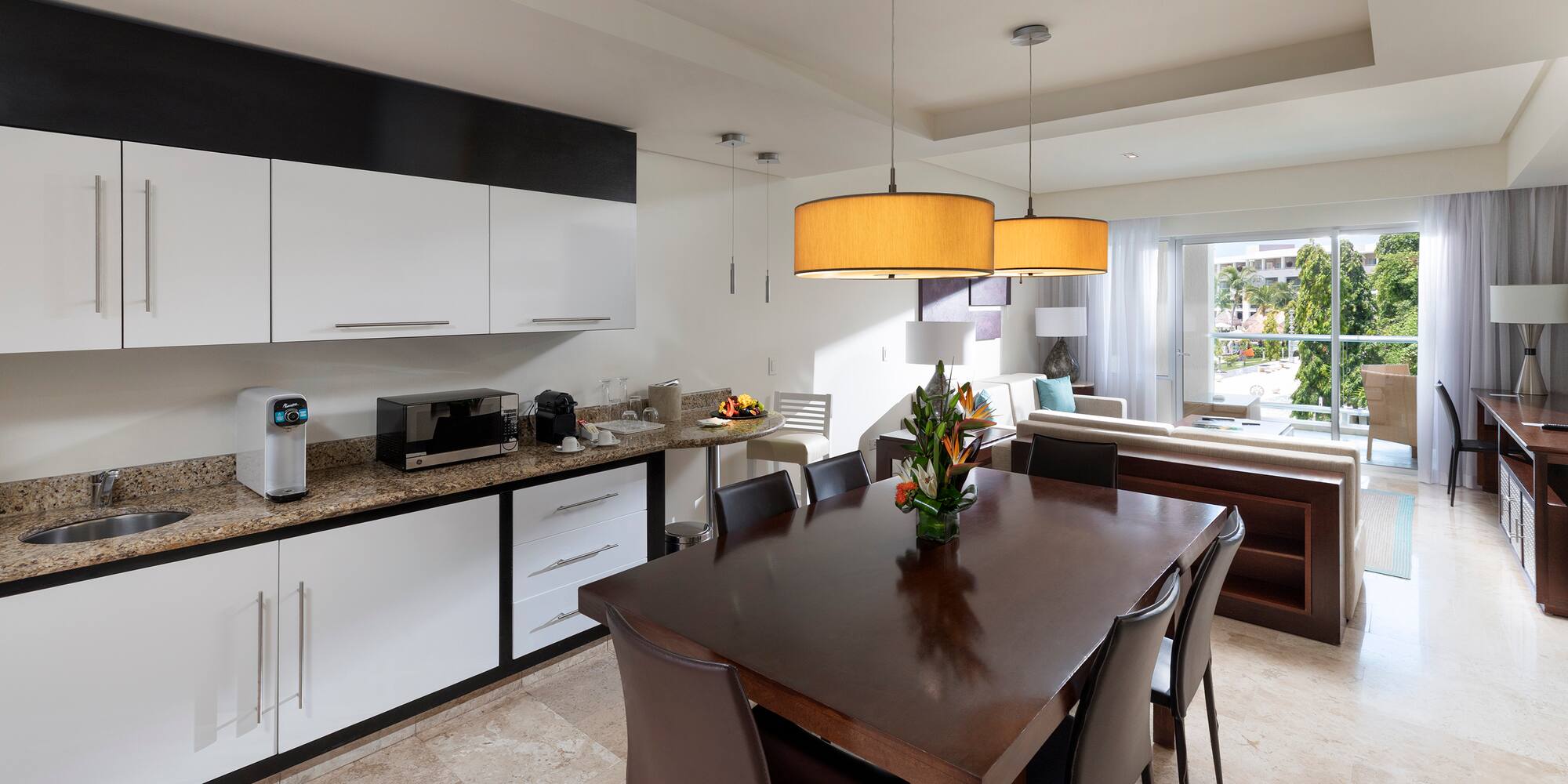 a kitchen with a table and chairs