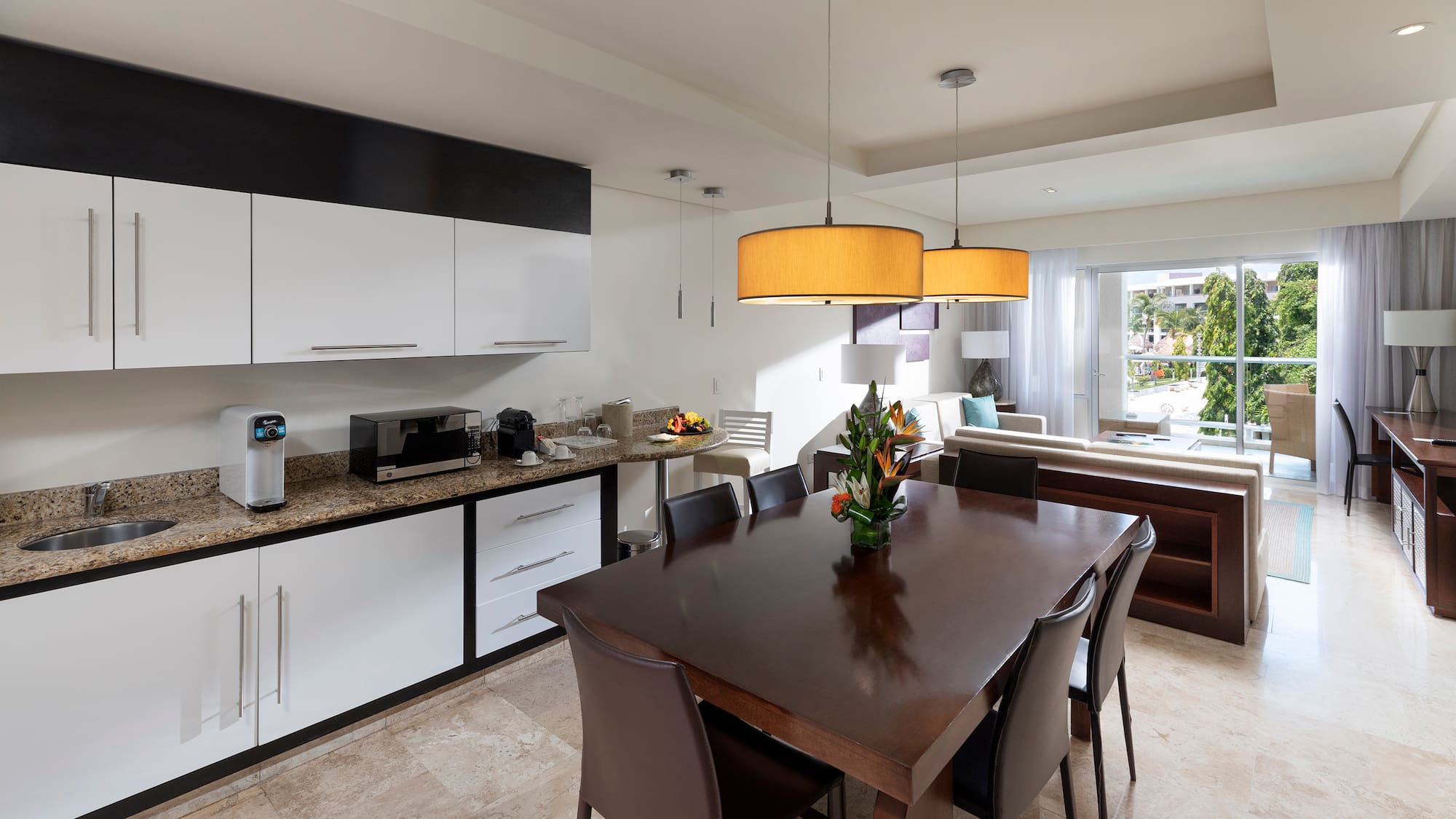 a kitchen with a table and chairs