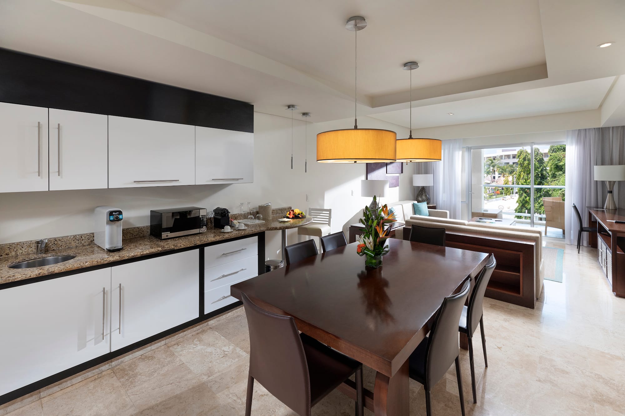 a kitchen with a table and chairs