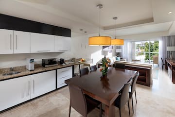 a kitchen with a table and chairs