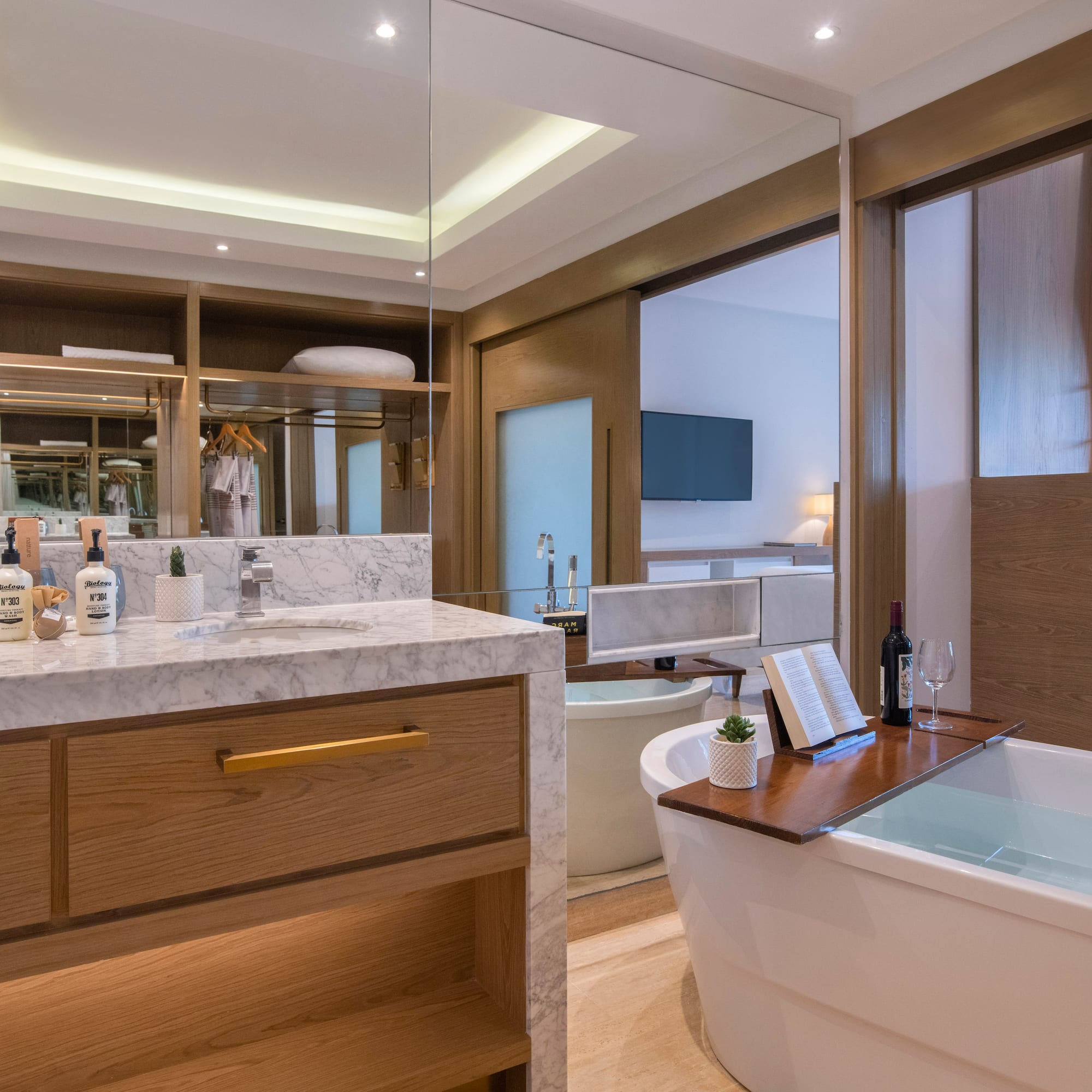 a bathroom with a tub and a mirror