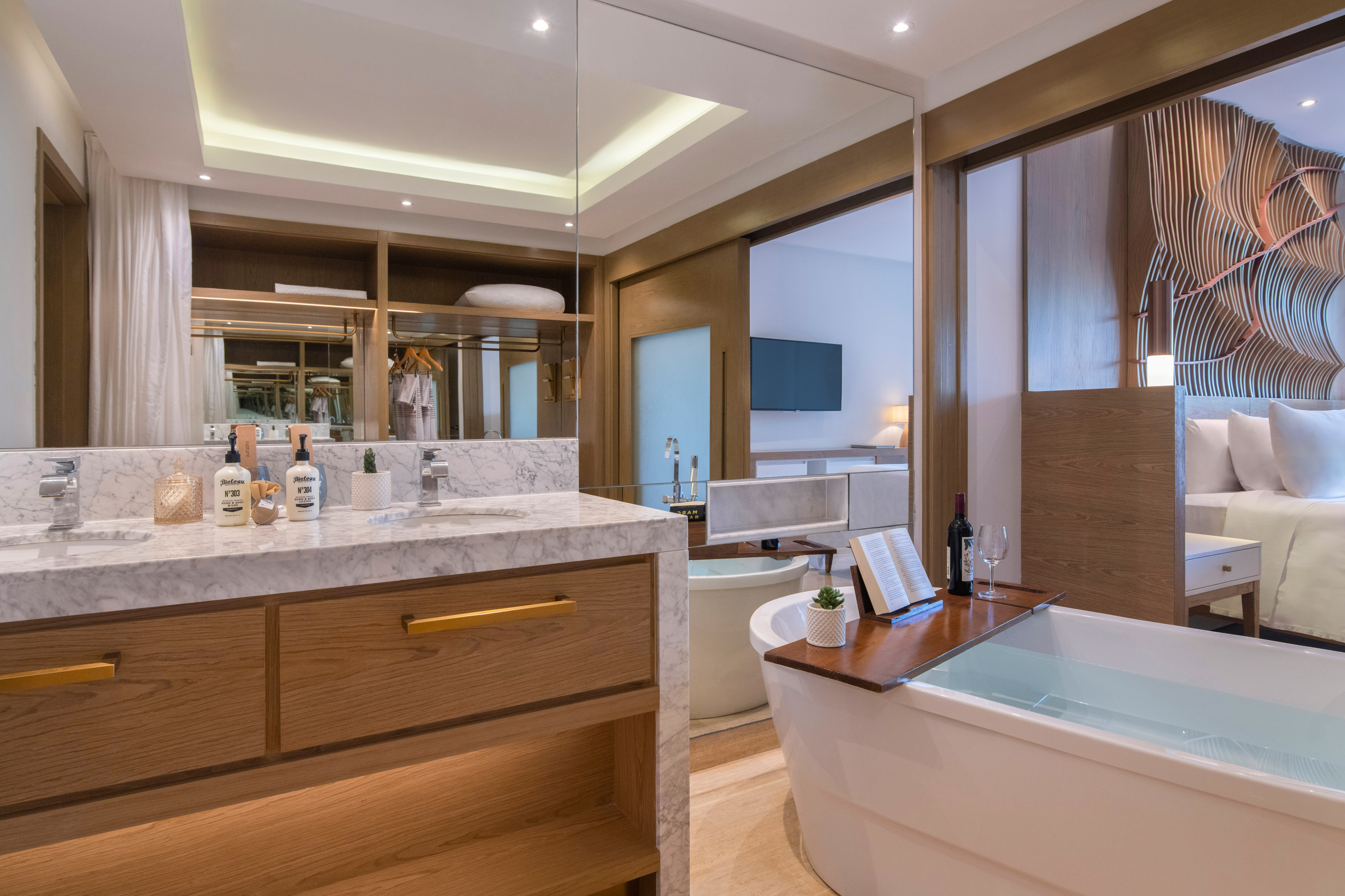 a bathroom with a tub and a mirror