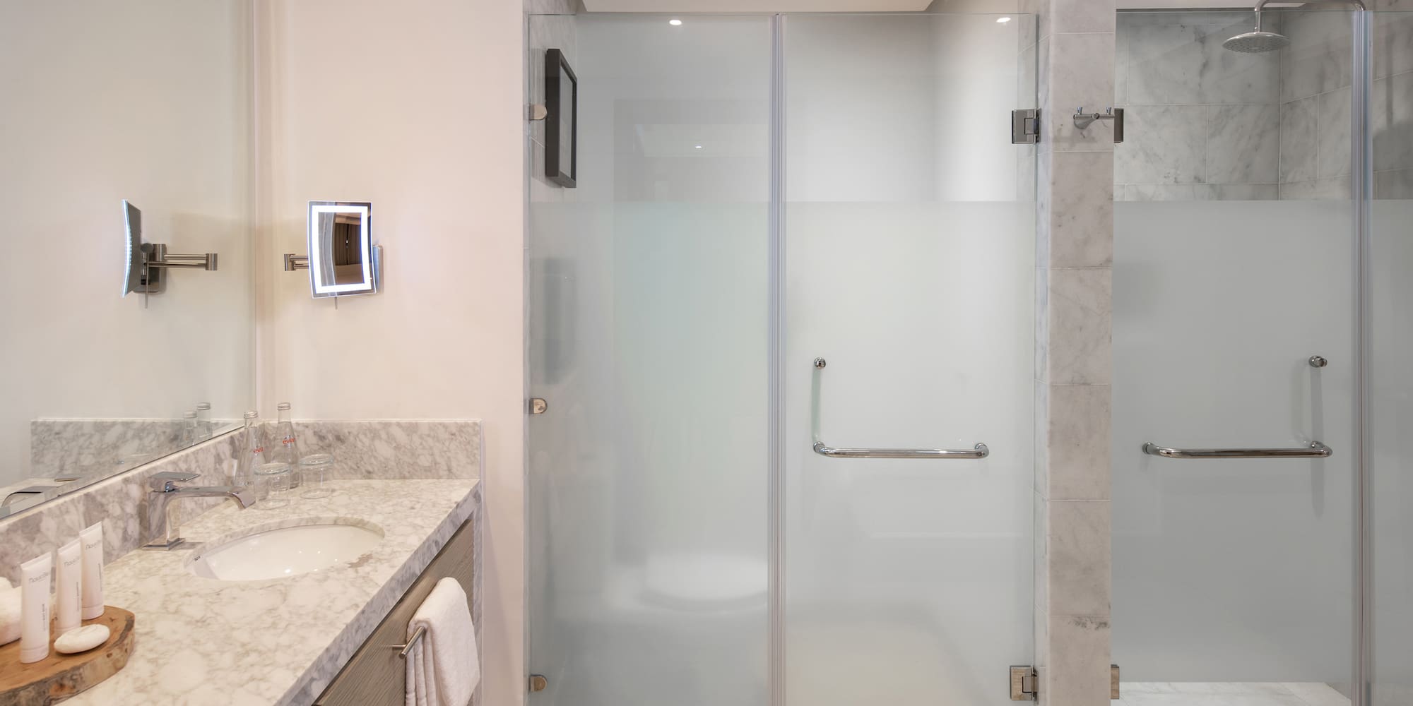 a bathroom with a glass shower door