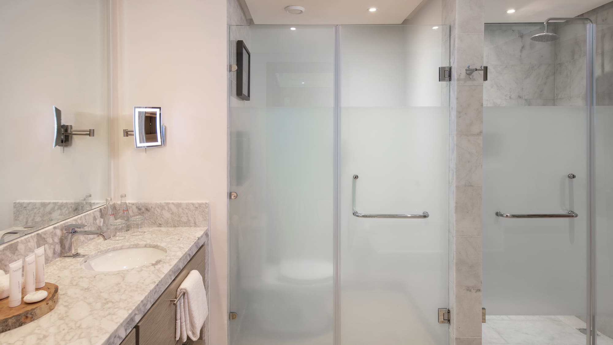 a bathroom with a glass shower door