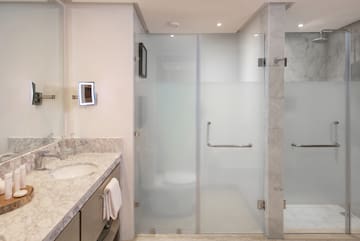 a bathroom with a glass shower door