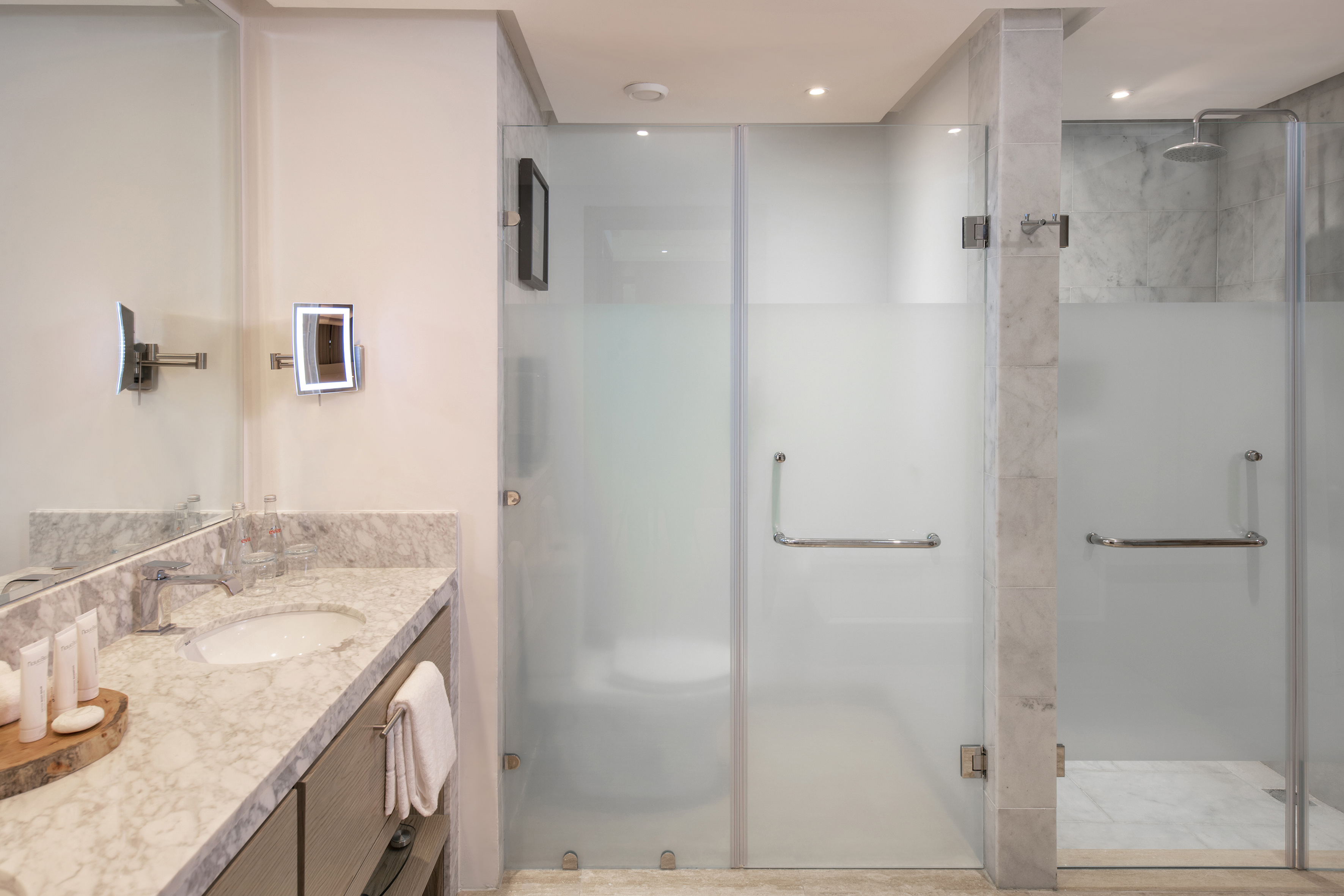 a bathroom with a glass shower door