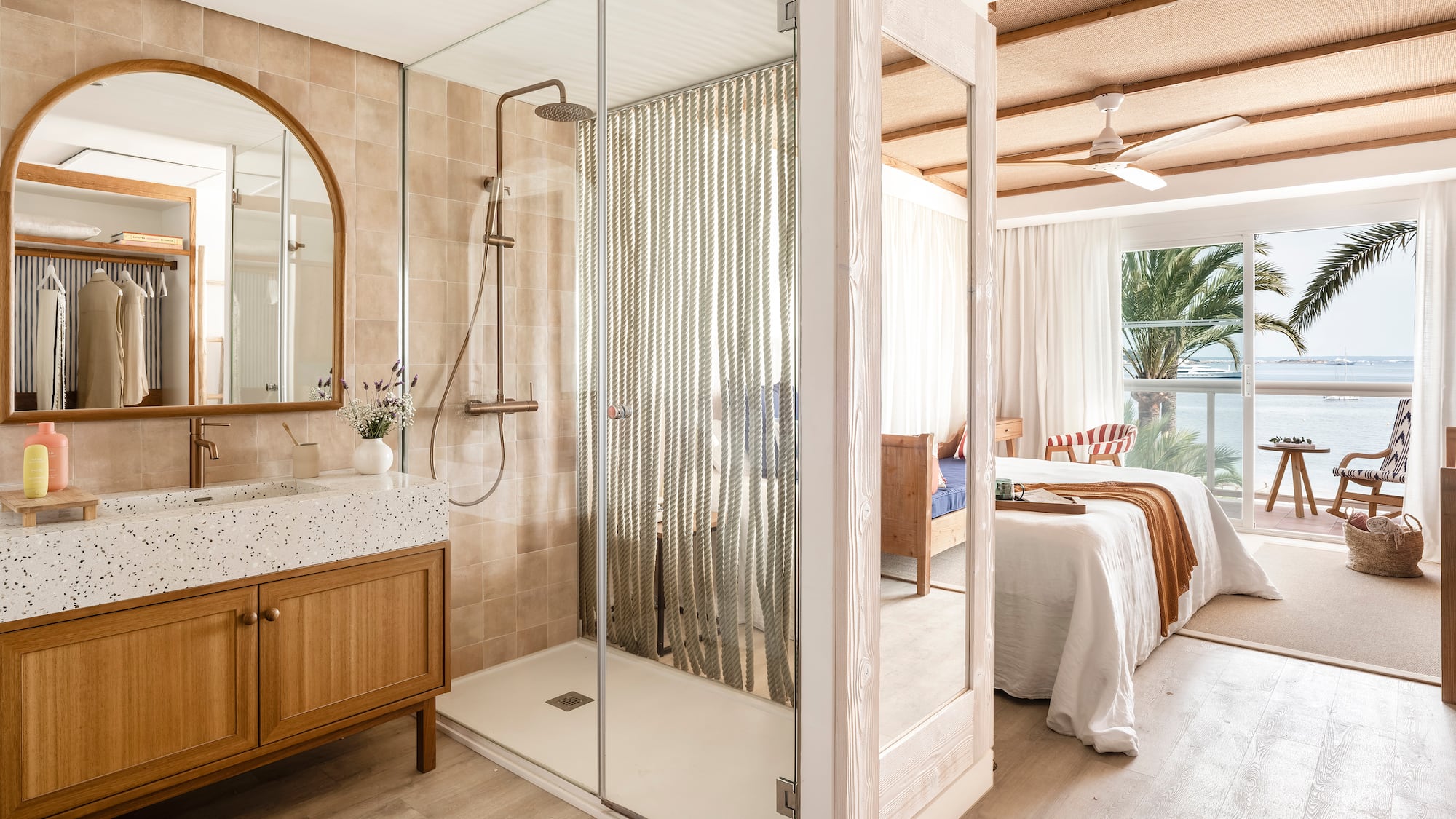 a bathroom with a shower and a bed