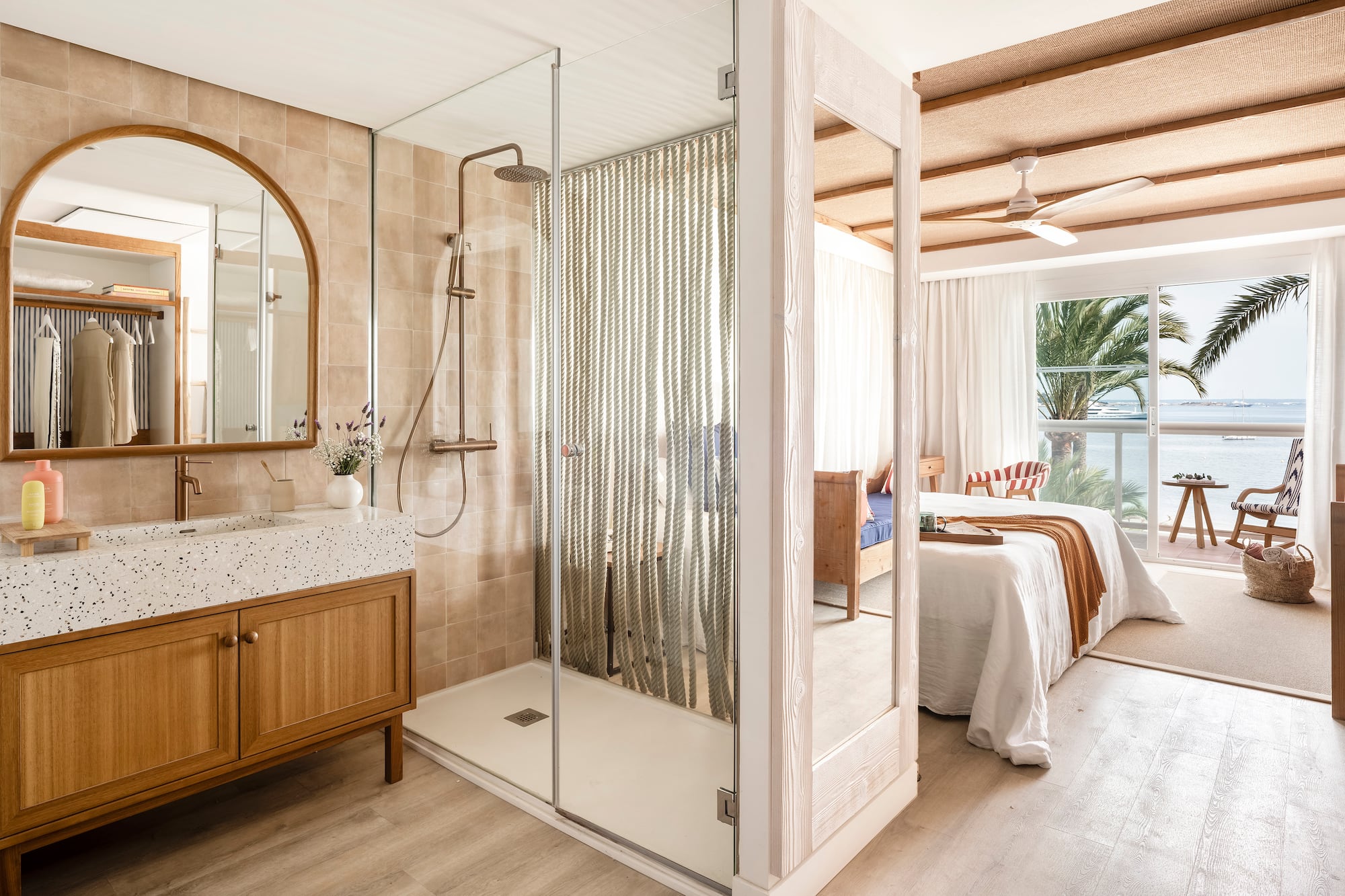 a bathroom with a shower and a bed