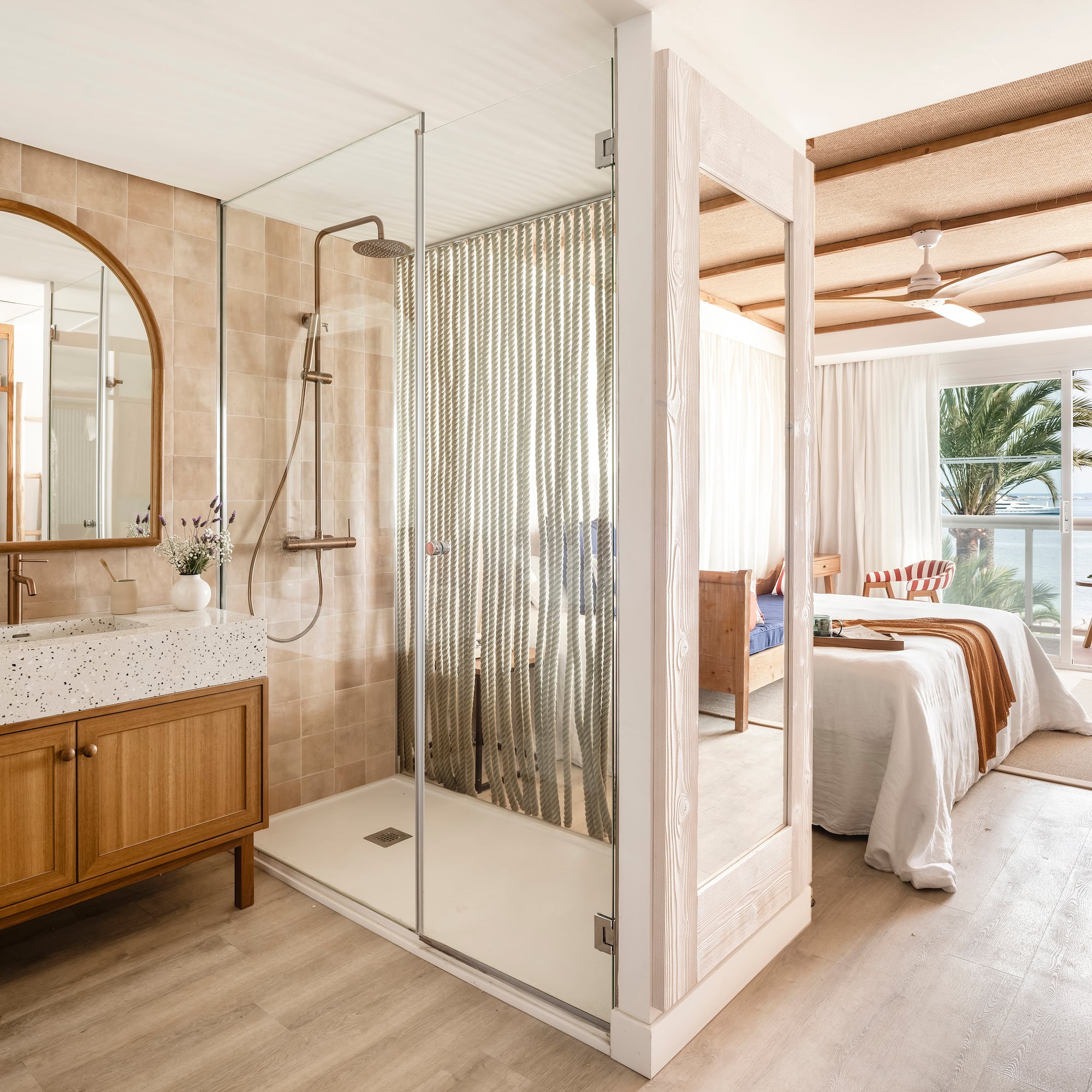 a bathroom with a shower and a bed