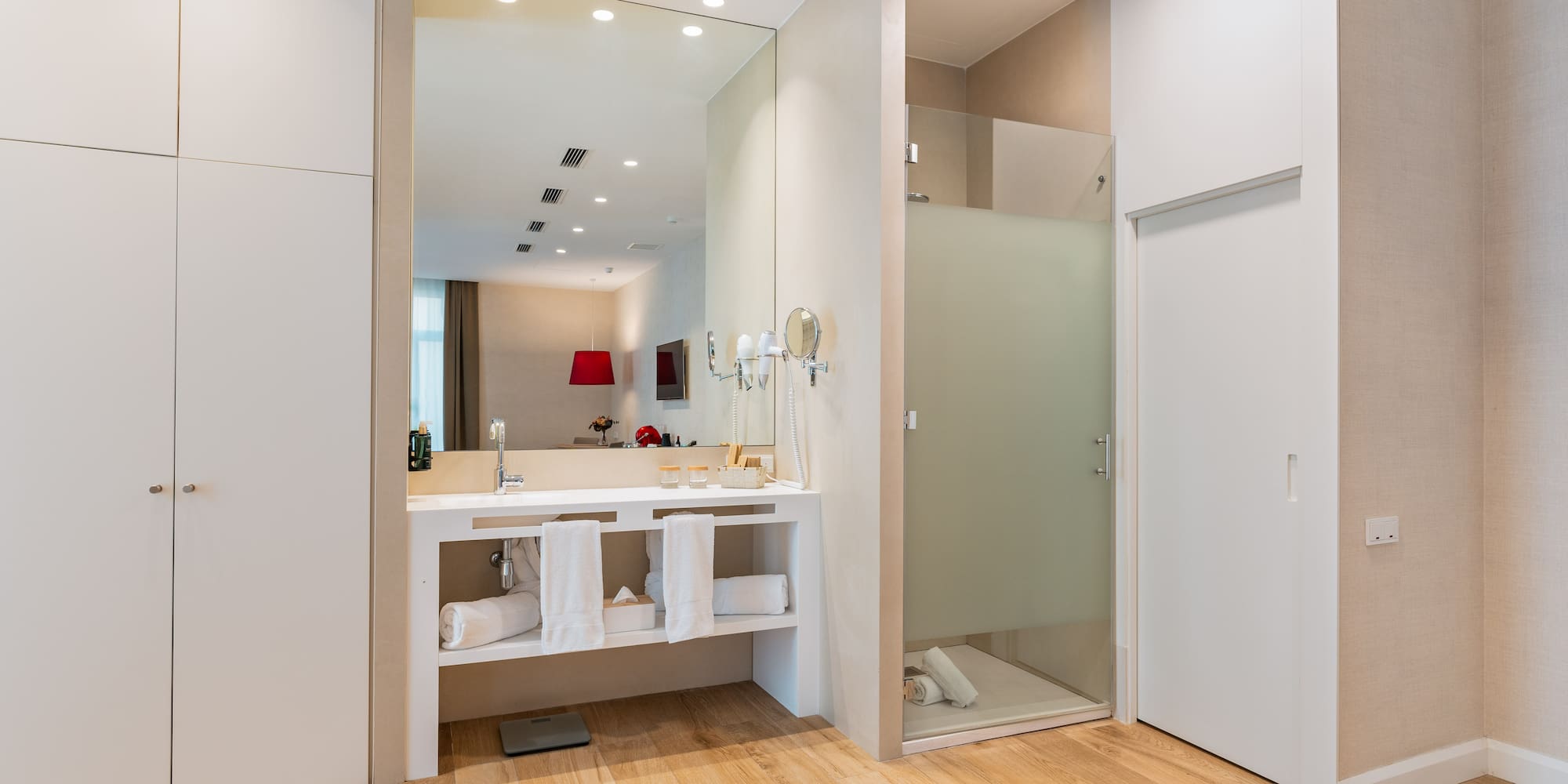 a bathroom with a shower and a sink