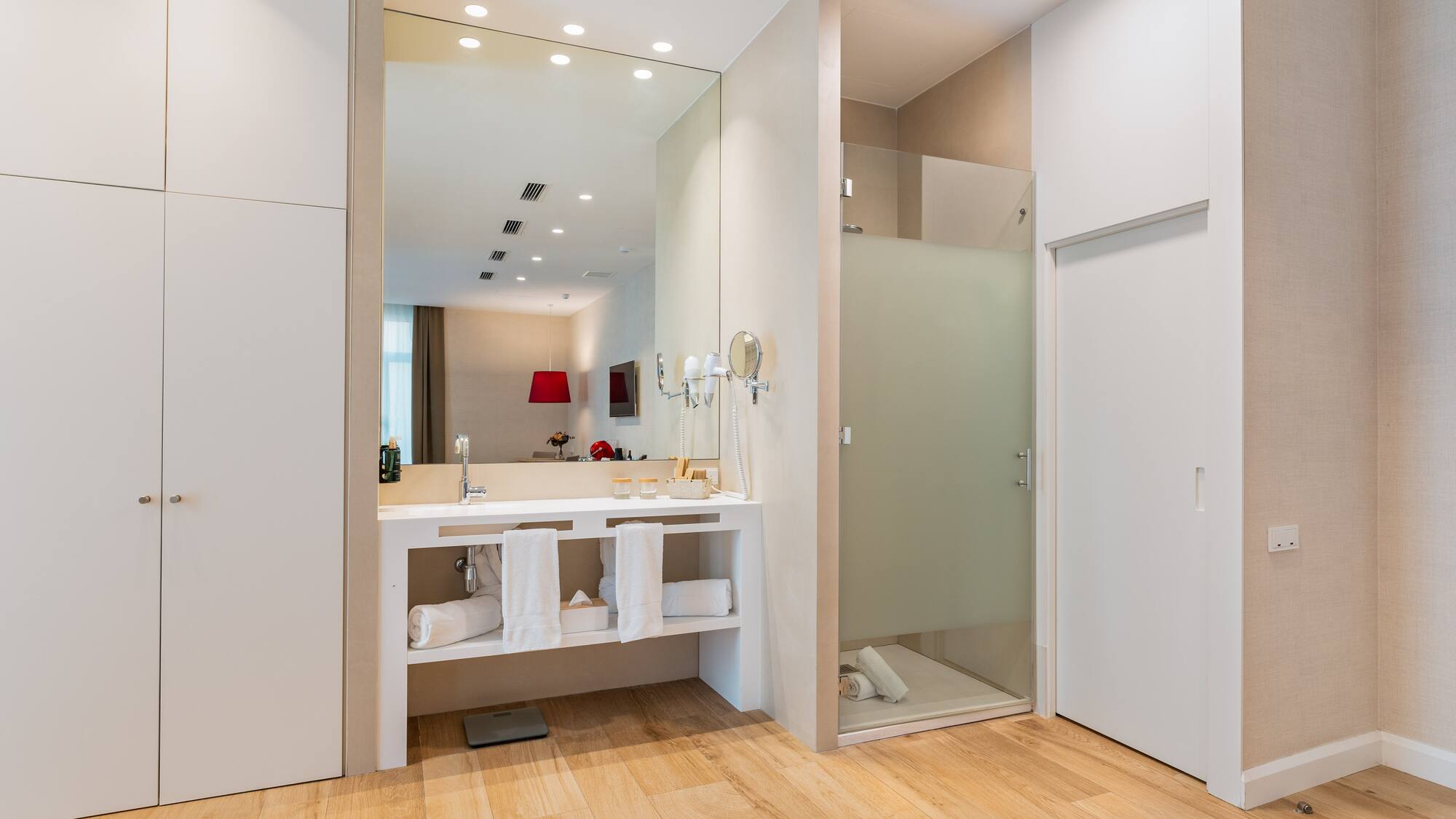 a bathroom with a shower and a sink