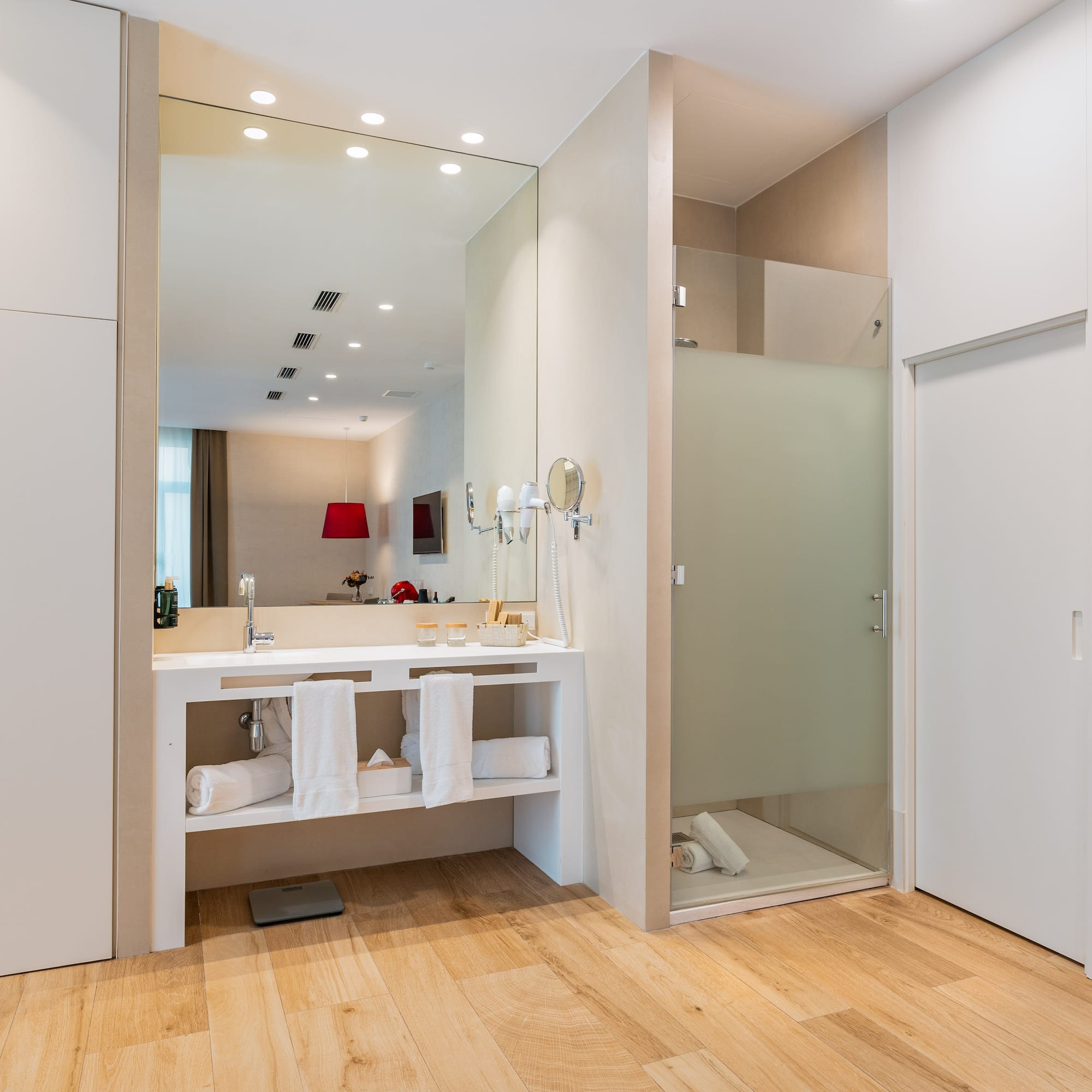a bathroom with a shower and a sink