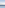 Infinity pool, sun loungers reflected in water, ocean, distant city skyline.