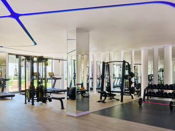 a large room with gym equipment