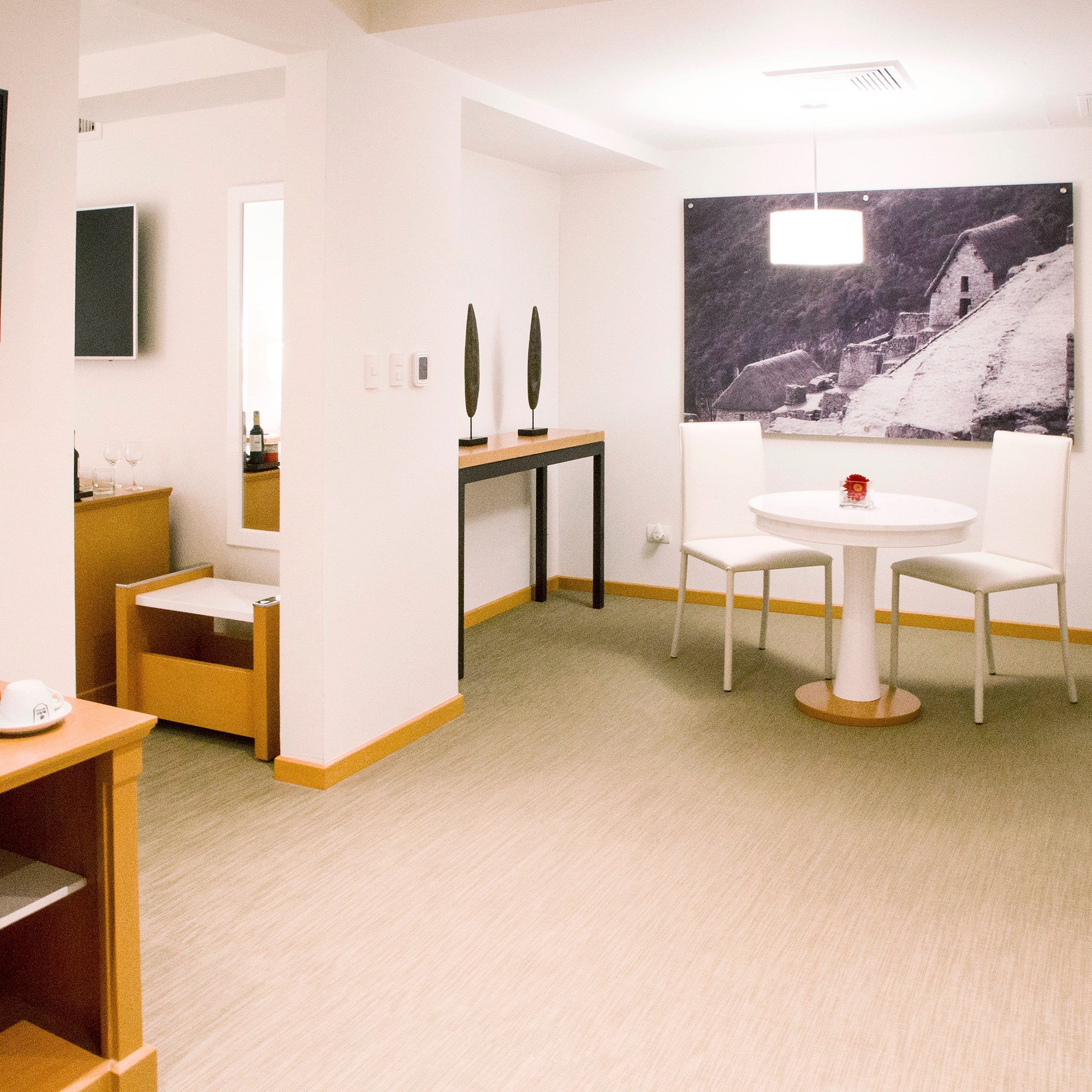 a room with a table and chairs