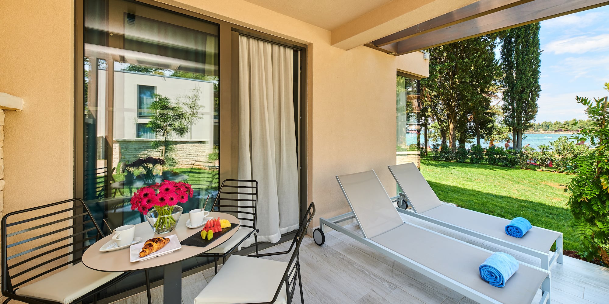 a patio with chairs and a table