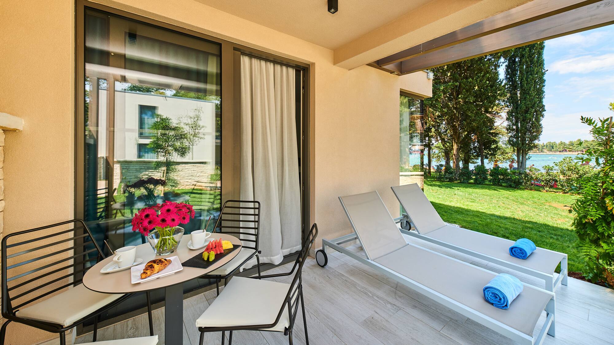 a patio with chairs and a table