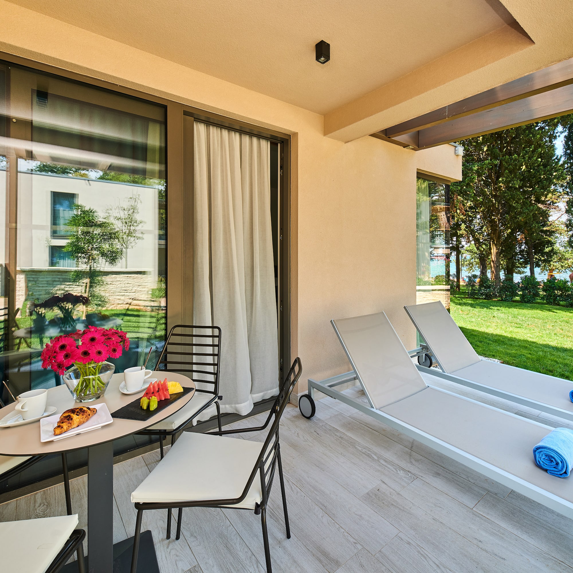 a patio with chairs and a table